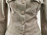 an image of a woman ' s military jacket with buttons