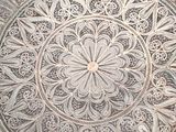 a silver plate that has a design on it