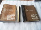 two books that are sitting on a bed together