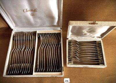 a lot of silverware in a box on a table