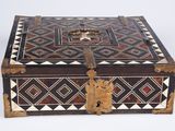 an old wooden box with a decorative design on it