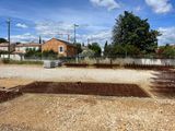 a lot of dirt in the middle of a yard