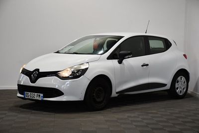 the white car is parked in a room with a checkered floor