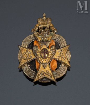 a close up of a badge with a crown on top of it
