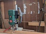 a picture of a man working on a piece of wood