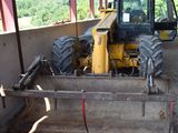 a bulldozer that is parked inside of a building