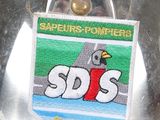 a close up of a metal object with a badge on it