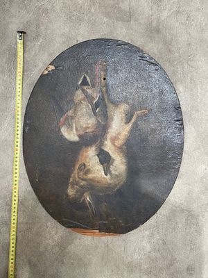 a picture of a picture of a cat and a bird on a plate