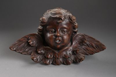 une image représentant une statue d'enfant ailé sur fond gris