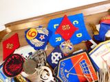 a wooden tray filled with different types of badges