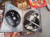 a person holding a dvd in their hand