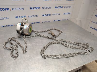 a chain with a ball attached to it sitting on a table