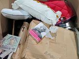 a cardboard box filled with lots of items that are in it