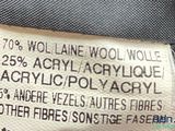 the label on the back of a black and white jacket