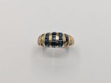 an image of a gold and blue stone ring