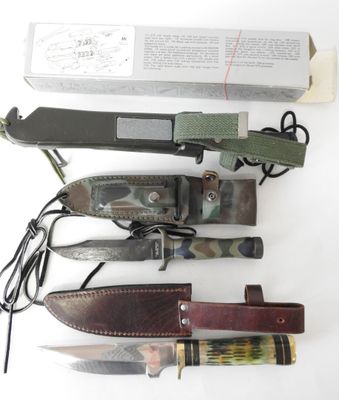 four different types of knives on a white surface
