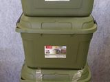 three green storage boxes stacked on top of each other