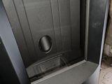 a toilet that is in the corner of a room