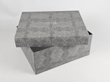 an open box with a black and white pattern on the inside