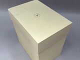 a white box with a hole in it on a table