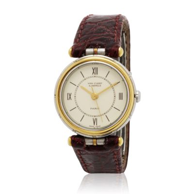 a close up of a wrist watch with roman numerals on it