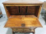 a wooden desk with a drawer on top of it