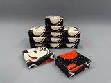 several black and white boxes with black and orange designs on them