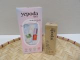 a box of lip balm and a bottle of lip balm on a tray