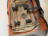 a backpack that is hanging on the wall in the room