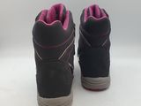 the back of a pair of children ' s black and pink boots
