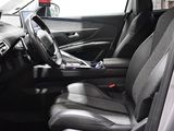 a picture of the interior of a car with a steering wheel