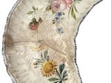 a white plate with a floral design on it