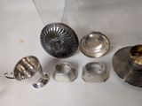 a lot of silver items that are on the table