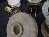 a lot of antique lamps that are sitting on a table