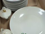 a lot of plates and bowls in a box