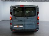 a grey van parked inside of a building