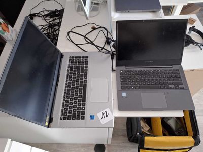 two laptops that are sitting on a desk