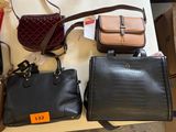 many different purses on a table in a store