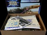 boxed box of star wars action figures including a star wars podracer and a box of cards