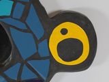 a blue and black clock with a yellow face on it