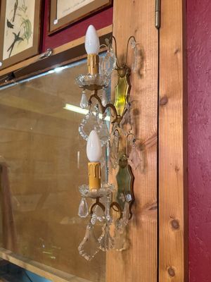 a picture of a wall sconce with a candle holder attached to it
