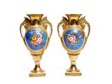 two vases that have been painted with flowers on them