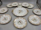 many plates that have birds on them on them