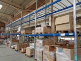 a large warehouse with a lot of boxes on the shelves