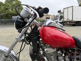 a red motorcycle that is parked in a parking lot
