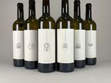 six bottles of wine are lined up on a table