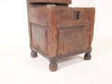 an old wooden box with a drawer on it