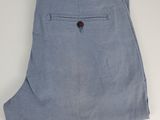 a close up of a pair of blue pants on a white surface