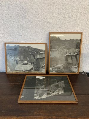 two framed photos of a man and a woman on a table