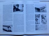 an open book with a picture of a man in a pilot ' s uniform